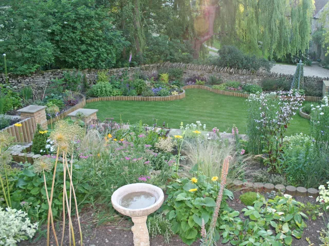 A view of an Arts and Crafts garden, in the style of Lutyens, designed by Capability Charlotte.