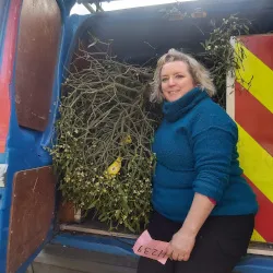 Charlotte with her van filled to the brim with mistletoe