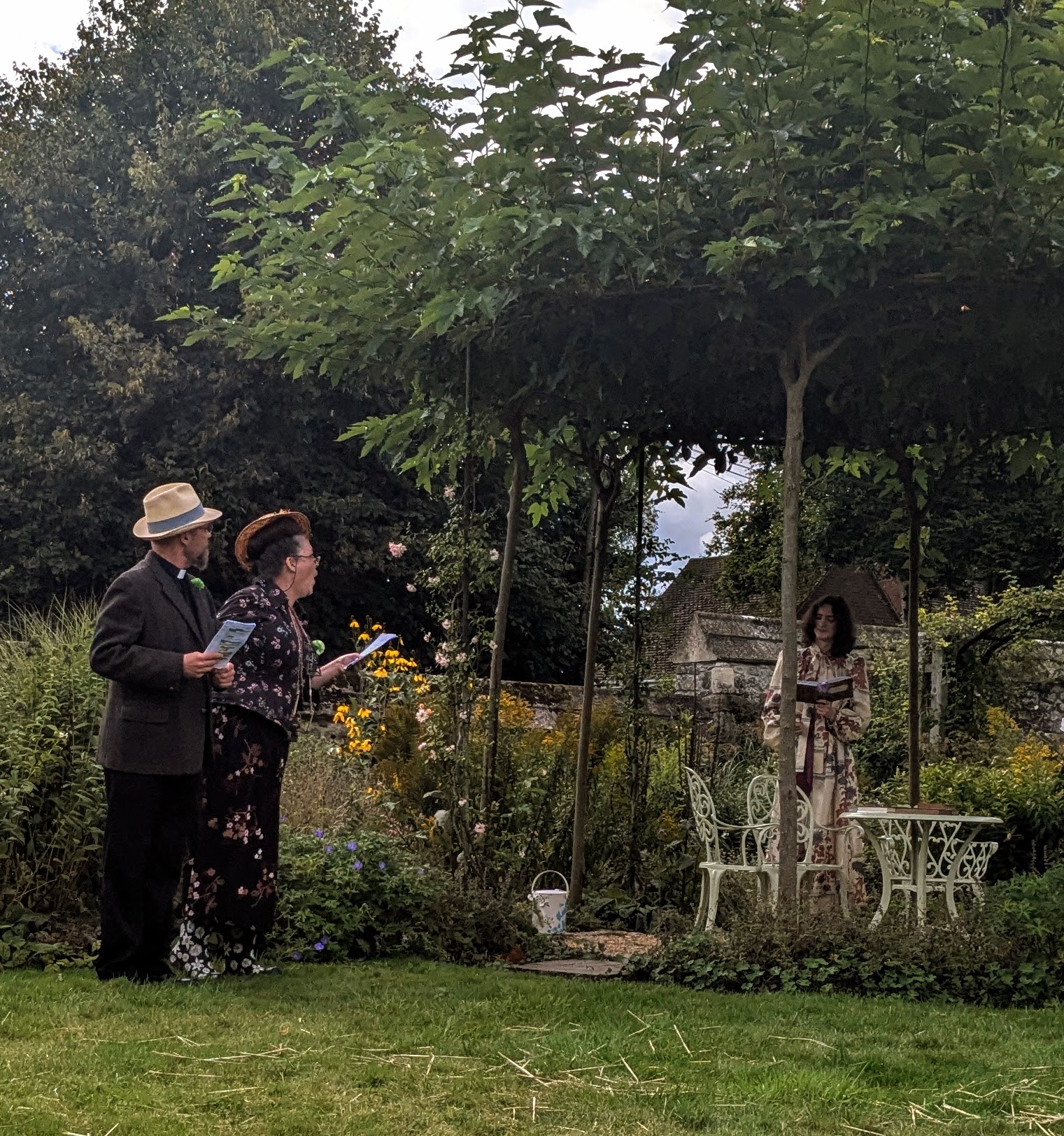 Dr Chasuble and Miss Prism meet Cecily in the garden